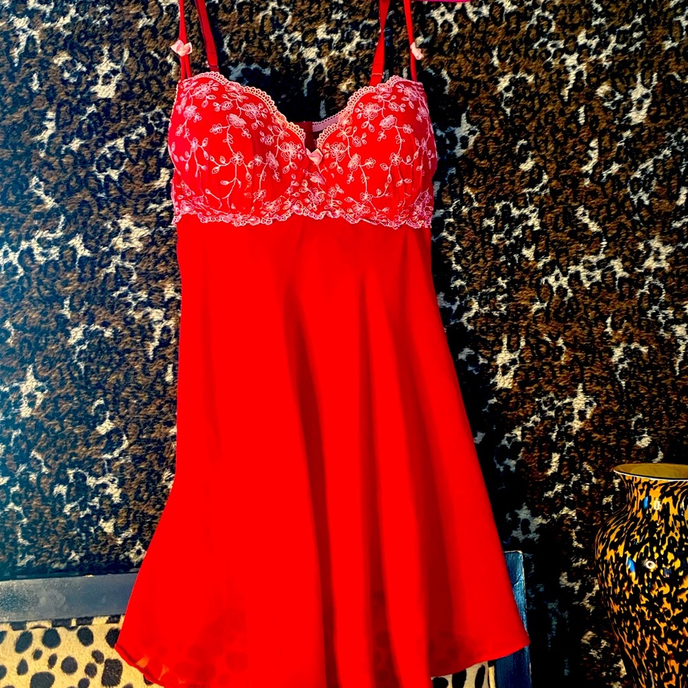 cute red and pink flower slip dress. It’s a little see-through. No stains.